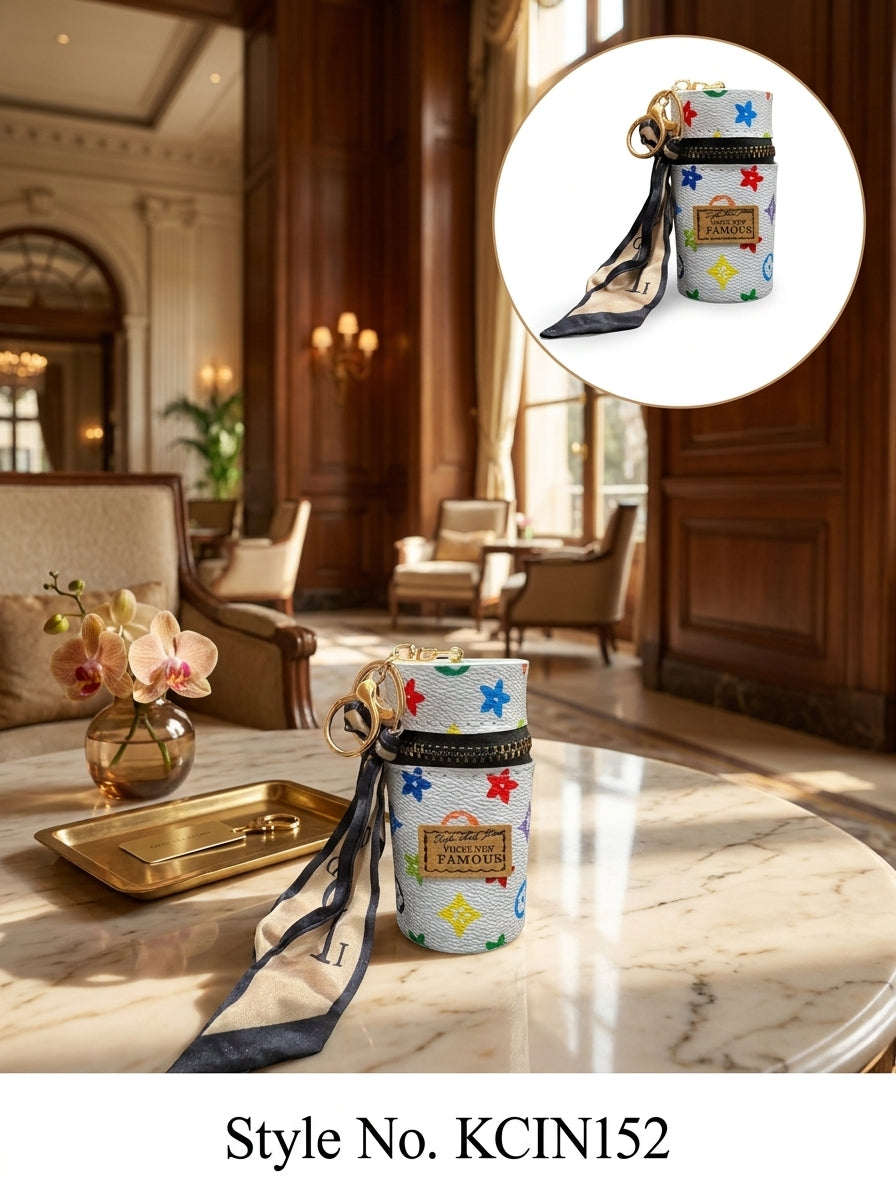 White cylindrical mini pouch with colorful star pattern Keychain | KCIN152